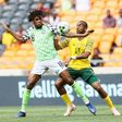South Africa's Tiyani Mabunda tackles Nigeria's Alexander Iwobi during the African Cup of Nations qualifier