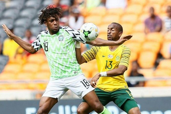 South Africa's Tiyani Mabunda tackles Nigeria's Alexander Iwobi during the African Cup of Nations qualifier
