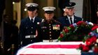 WASHINGTON, DC - DECEMBER 4: Members of a joint-service honor guard perform a changing of the guard as the casket of the late former President George H.W. Bush lies in state at the U.S. Capitol, December 4, 2018 in Washington, DC. A WWII combat veteran...