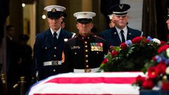 WASHINGTON, DC - DECEMBER 4: Members of a joint-service honor guard perform a changing of the guard as the casket of the late former President George H.W. Bush lies in state at the U.S. Capitol, December 4, 2018 in Washington, DC. A WWII combat veteran...