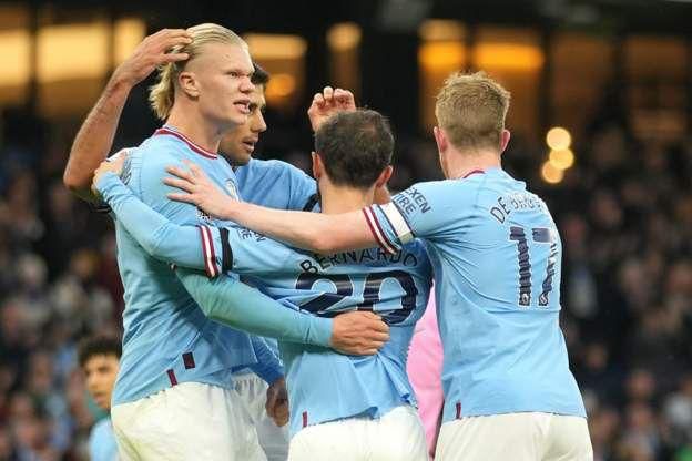 Erling Haaland celebrates with his Man City teammates after opening the scoring against Everton