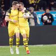 Match-winner Paco Alcacer (R) is congratulated by Danish forward Jacob Bruun Larsen (L) as Borussia Dortmund came back from two goals down to win 3-2 at Bayer Leverkusen on Saturday and knock Bayern Munich from top spot in the Bundesliga.
