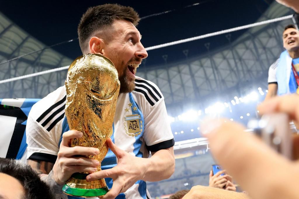Lionel Messi of Argentina celebrates with the FIFA World Cup Qatar 2022 Winner's Trophy.Gustavo Pagano/Getty Images