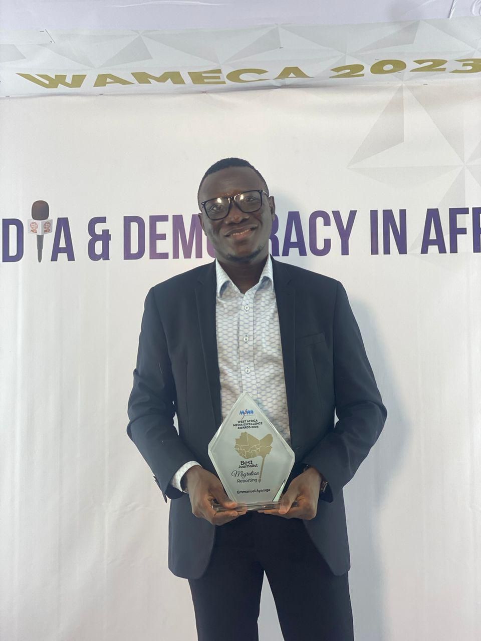 Emmanuel Ayamga with his winning prize