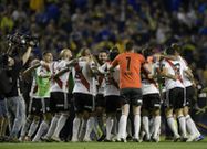River Plate's players celebrate beating Boca Juniors 2-0 at the Bombonera in the Argentine Primera Division in September