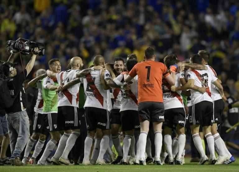 River Plate's players celebrate beating Boca Juniors 2-0 at the Bombonera in the Argentine Primera Division in September