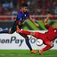 Vietnam defender Nguyen Trong Hoang (R) and Philippines forward Patrick Reichelt fight for the ball during the second leg of their AFF Suzuki Cup semifinal in Hanoi