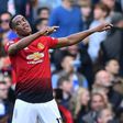 Manchester United forward Anthony Martial (right) celebrates his second goal against Chelsea
