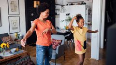 A nanny paying with a child