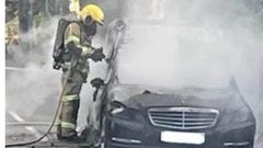 Mercedes-Benz hearse carrying coffin to funeral catches fire