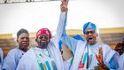 Muhammadu Buhari raises Bola Tinubu's hand [Twitter/@officialABAT]