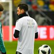 Germany head coach Joachim Loew (L) talks to midfielder Mesut Ozil during a training session last March. Ozil quit international duty in July, citing racism and disrespect within the German FA (DFB) and has reportedly broken contact with Loew.