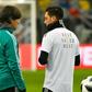 Germany head coach Joachim Loew (L) talks to midfielder Mesut Ozil during a training session last March. Ozil quit international duty in July, citing racism and disrespect within the German FA (DFB) and has reportedly broken contact with Loew.