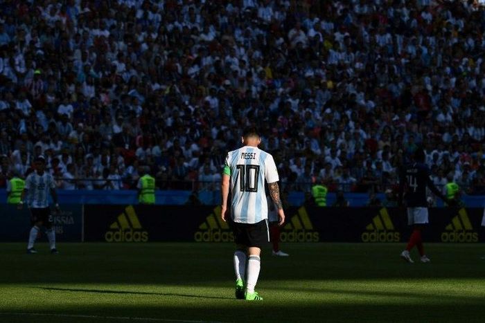 Game over: Argentina's Lionel Messi walking off the pitch after their 4-3 defeat to France at the World Cup.