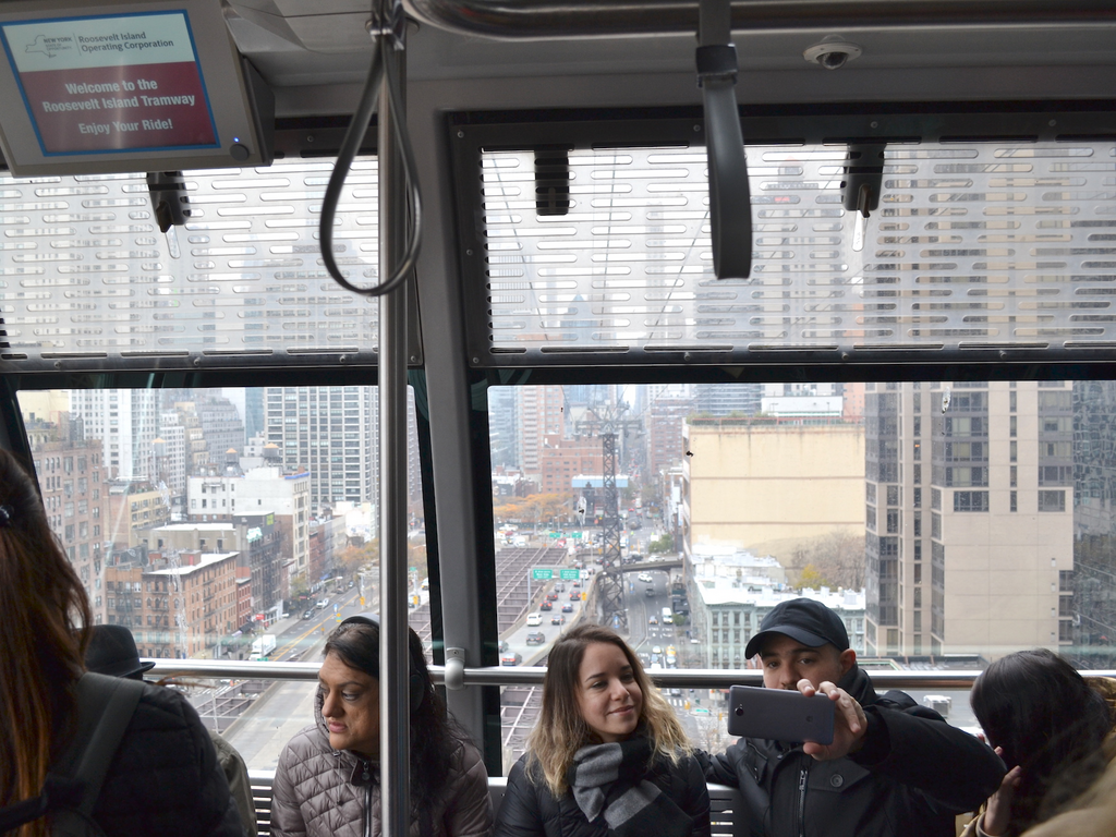 One of New York City's most affordable tourist experiences is a tram that takes you 250 feet above the city for the price of a subway fare