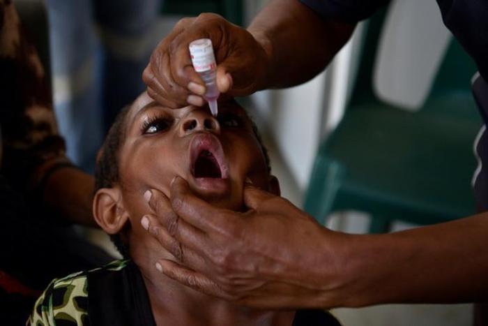 Six-year-old Warapnong Ponde is given a polio vaccination in a mobile clinic in rural Papua New Guinea, as the impoverished country fights a new outbreak of a disease which had previously been eradicated
