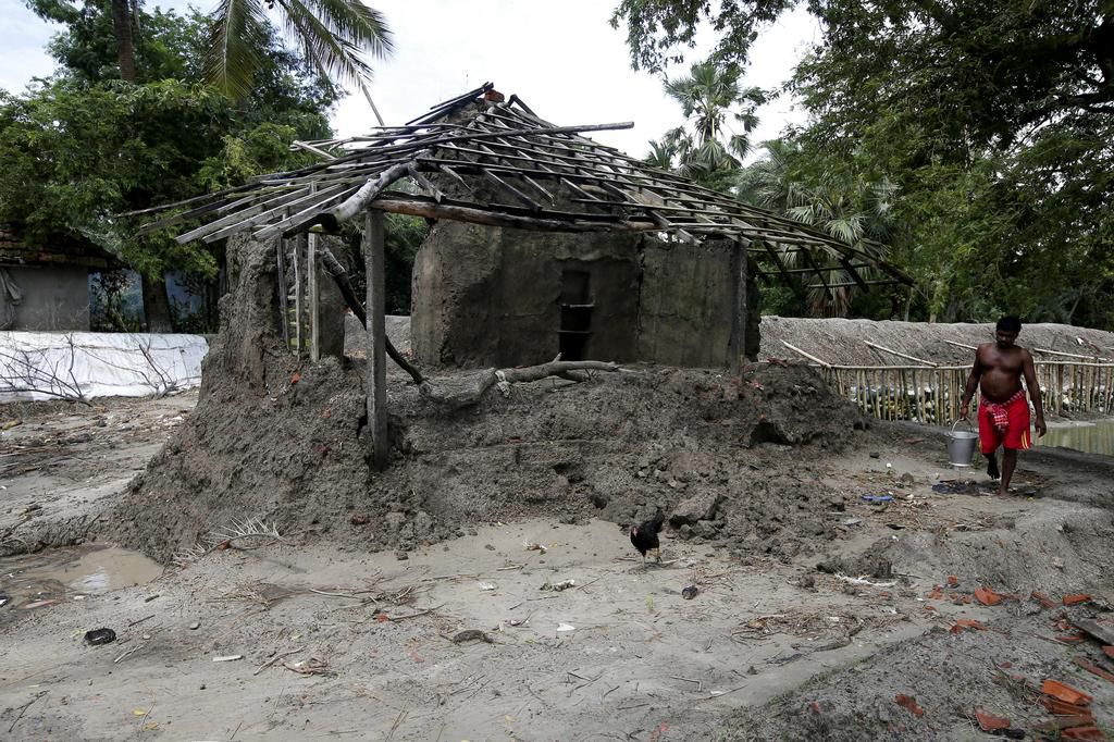 An island in India is disappearing, but some of the last residents say they can't afford to move away