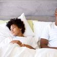 Unhappy couple in bed