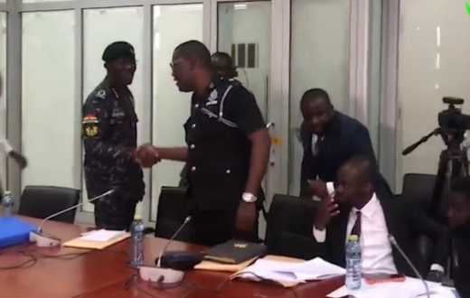 IGP Dampare exchanges pleasantries in a handshake with Supt. Asare wants him removed