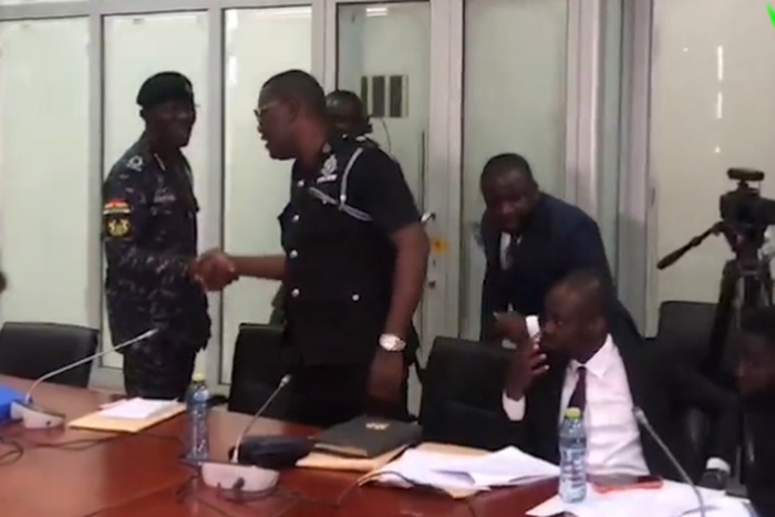 IGP Dampare exchanges pleasantries in a handshake with Supt. Asare wants him removed