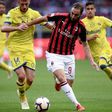 Chievo defender Mattia Bani struggles to contain AC Milan's Gonzalo Higuain in last weekend's defeat for the Verona club