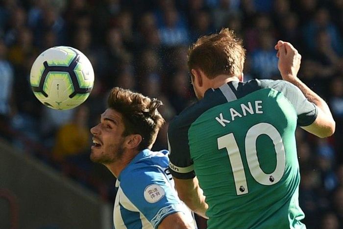Harry Kane scores the opening goal for Tottenham against Huddersfield