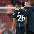 Manchester City manager Pep Guardiola consoles Riyad Mahrez after his missed penalty against Liverpool
