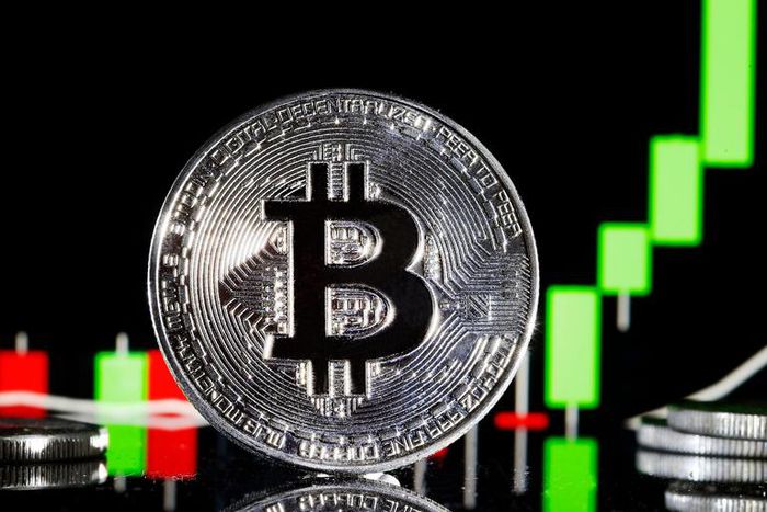 A visual representation of the digital Cryptocurrency, Bitcoin is on display in front of the Bitcoin course's graphChesnot/Getty Images