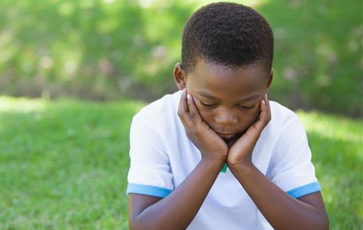 Unrelated stock photo of sad-depressed-young-black-boy