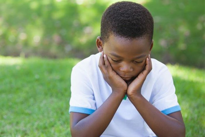 Unrelated stock photo of sad-depressed-young-black-boy