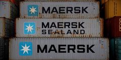 FILE PHOTO: FILE PHOTO: Empty Maersk shipping containers are seen stacked at Peel Ports container terminal in Liverpool, Britain, December 9, 2016. REUTERS/Phil Noble/File Photo