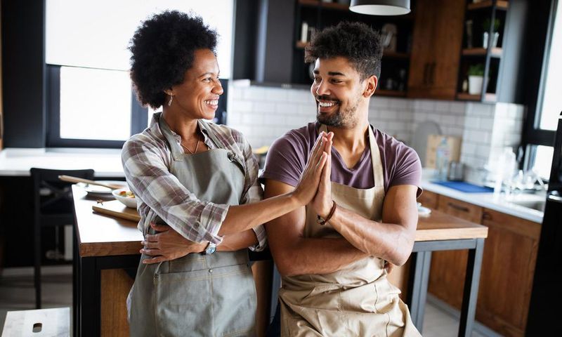 mother and adult son in the kitchen