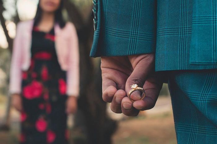 A man holding an engagement ring about to propose [Photo: Jesus Arias]