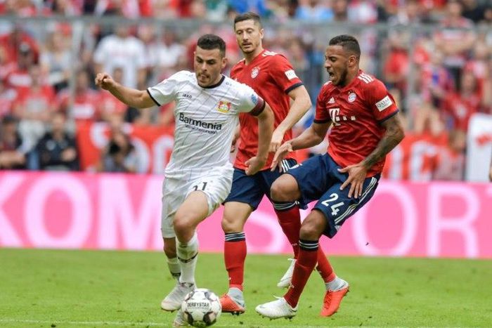 Bayern Munich's France midfielder Corentin Tolisso (R) tore the cruciate ligament in his right knee after being tackled by Bayer Leverkusen's Kevin Volland (L) in Bayern's 3-1 home win on Saturday.