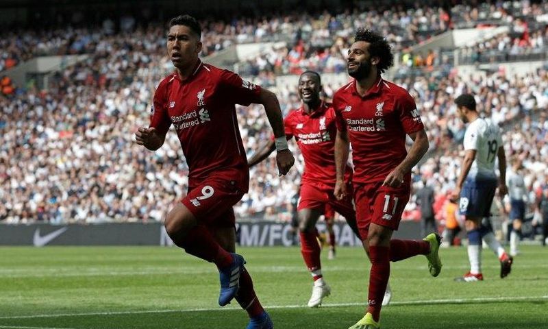 Eye-watering: Liverpool striker Roberto Firmino is not fit to start Tuesday's Champions League clash with Paris Saint-Germain