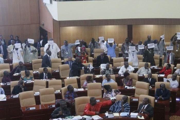 The minority members carrying sheets of papers with the inscription “dead goat budget” immediately after Mr. Seth Terkper, the Finance Minister,  concluded his delivery.