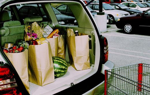 Groceries in back of car, parked in parking lot (Cross Processed)