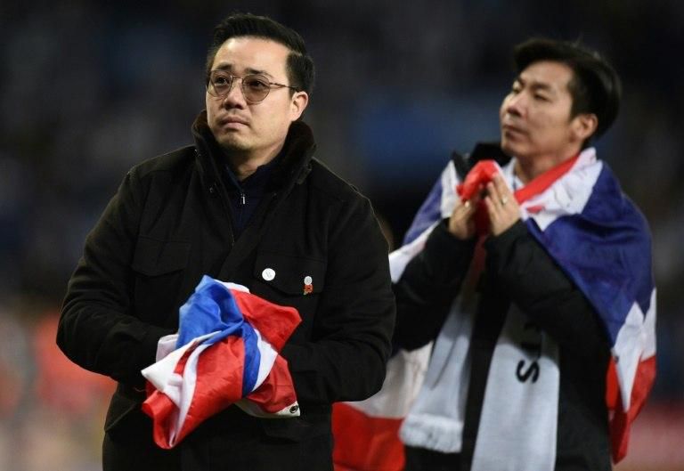 Aiyawatt Srivaddhanaprabha (L) joined players and staff in a lap of the pitch after Saturday's emotional game