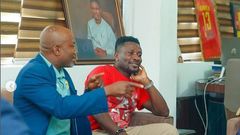 Asamoah Gyan comforts manager Anim Addo after losing GFA Executive Council elections