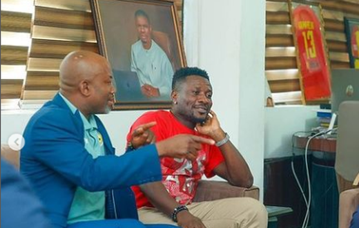 Asamoah Gyan comforts manager Anim Addo after losing GFA Executive Council elections