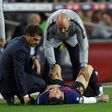 Lionel Messi receives attention after injuring his arm on Saturday