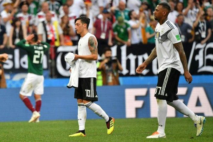 Mesut Ozil (L) took to Instagram to thank his former Germany team-mate defender Jerome Boateng (R) for publically supporting him in the wake of the Arsenal midfielder's controversial retirement from international football.