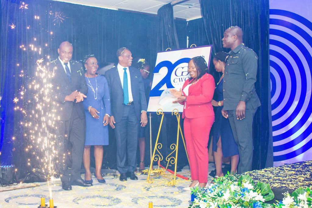 Dignitaries unveiling the CWG Ghana at 20 anniversary logo