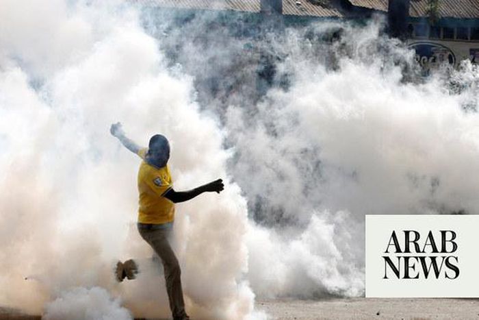A protestor being tear gased