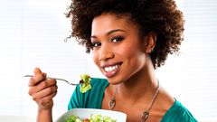 Woman eating vegetables(ebony)