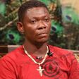Agya Koo in a red T-shirt