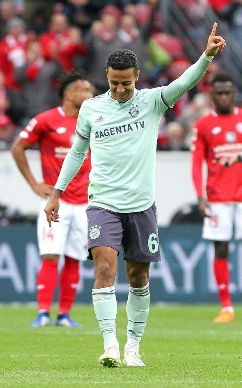 Thiago Alcantara celebrates scoring the winning goal in Bayern Munich's 2-1 away victory on Saturday at Mainz which lifted the Bavarian giants from fourth to second in the league table.