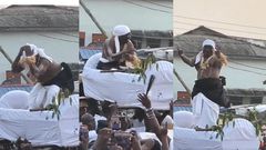 Paramount chief of Elmina joyfully dances to King Paluta's Aseda in palanquin
