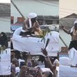 Paramount chief of Elmina joyfully dances to King Paluta's Aseda in palanquin