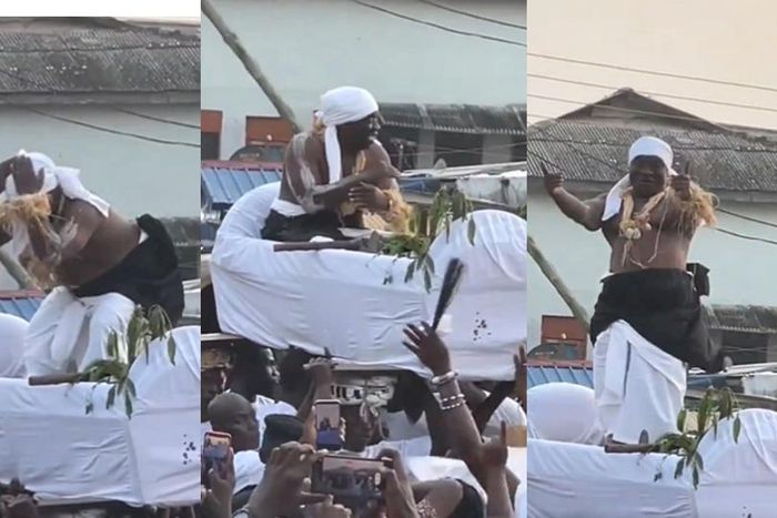 Paramount chief of Elmina joyfully dances to King Paluta's Aseda in palanquin
